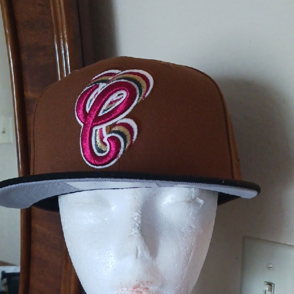 Brown Cap with Pink Embroidered Logo.